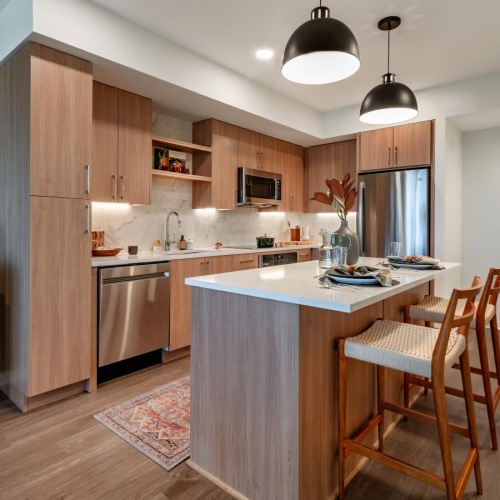 Immerse yourself in possibilities a kitchen with a bar and a dining table