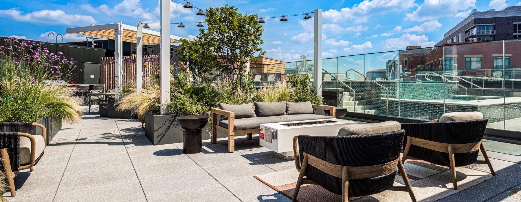 a patio with tables and chairs