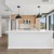 Kitchen with tile backsplash, stainless steel appliances, and under cabinet lighting