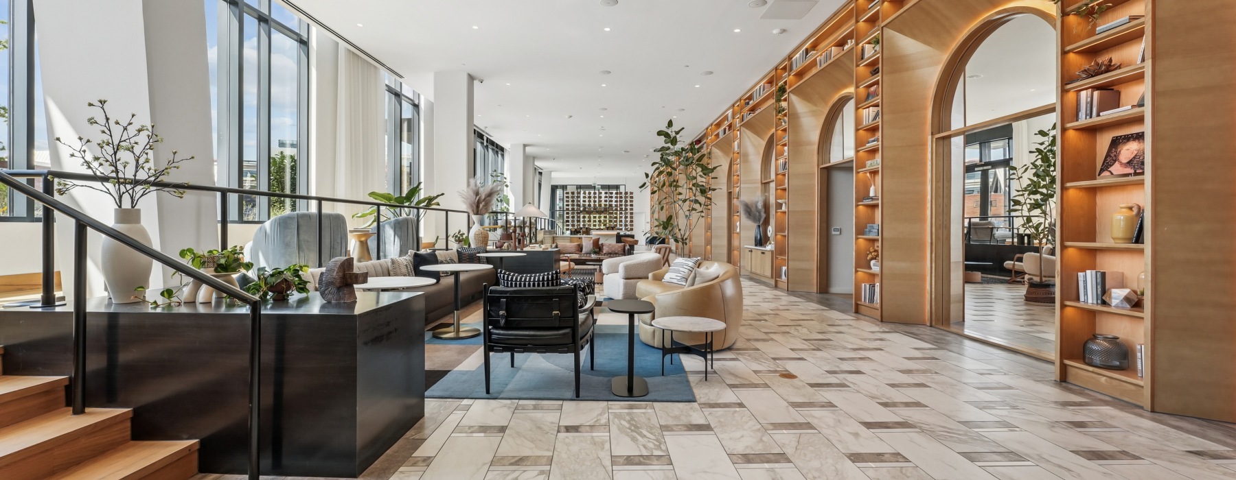 Large, open and welcoming lobby entrance with ample seating, a concierge desk and designer finishes 