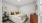 Bedroom with queen sized bed, dresser, and night stand